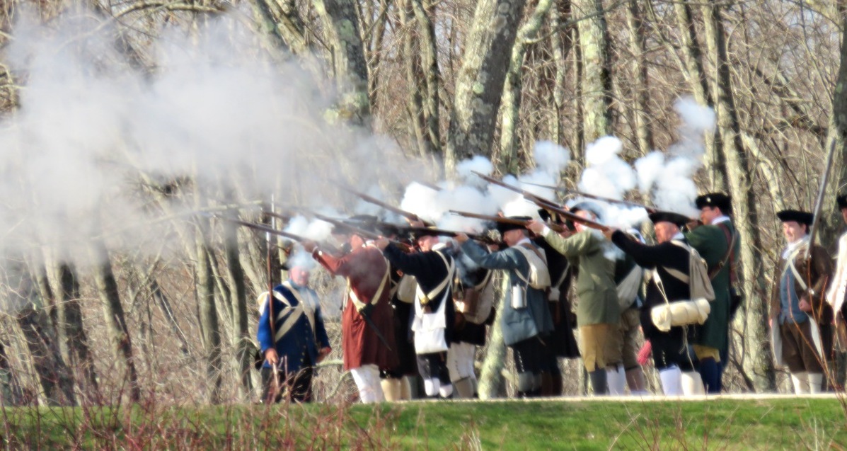 Minutemen fire at the Redcoats across Concord North Bridge